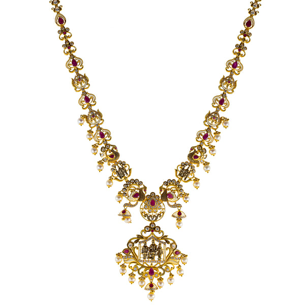 22K Antique Gold Temple Necklace w/ CZ, Ruby & Pearl (81.6gm) | 



This 22k antique gold temple necklace from Virani Jewelers exudes sophistication, blending tr...