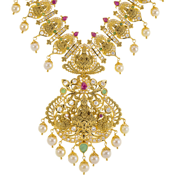 22K Yellow Gold Temple Necklace w/ Emerald, Ruby, CZ, and Pearl (82gm) | 



Adorning your neck with this lovely 22k gold temple necklace by Virani Jewelers brings the el...