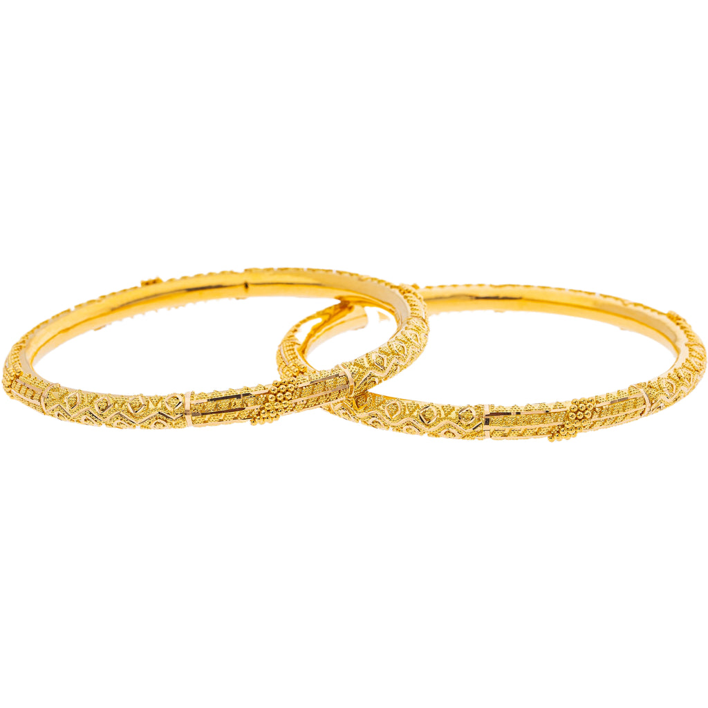 22K Yellow Gold Bangle Set of 2 (35.5gm) | 



Revel in the simplistic artistry of this 22k gold bangle set by Virani Jewelers, showcasing t...