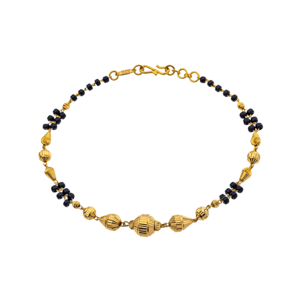 22K Yellow Gold & Black Bead 7 inch Bracelet (5.9gm) | 



The 22k yellow gold and black beaded of this bracelet by Virani Jewelers adds a touch of spir...