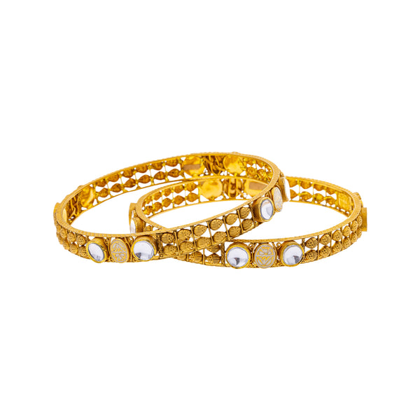 22K Yellow Gold & Kundan Bangle Set of 2 in Size 2.6 (33.4gm) | 



Adorn yourself with this set of two 22k yellow gold bangles by Virani Jewelers, featuring ric...