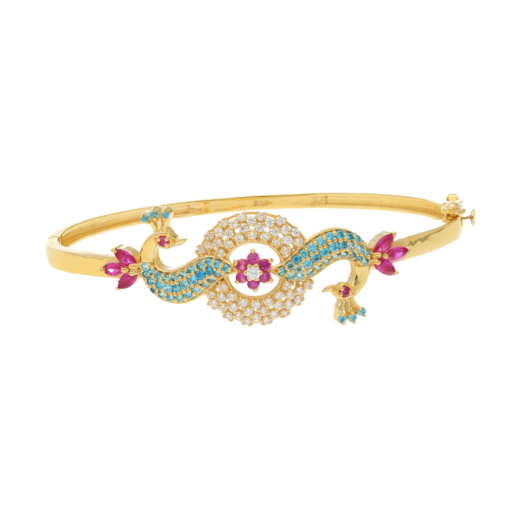 22K Yellow Gold Peacock Bangle with Ruby, CZ, & Sapphires (15 grams) | 



This 22k yellow gold peacock bangle by Virani Jewelers is a true work of art, showcasing the ...